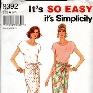 May include: A sewing pattern for two skirts. The pattern is for sizes 6-16. The skirts are both wrap skirts, one with a white background and red polka dots, and the other with a floral print. The pattern is titled "It's SO EASY it's Simplicity."