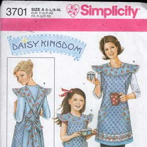 May include: Simplicity sewing pattern 3701 featuring aprons with a cherry and gingham design. The aprons are worn by a woman and a girl, and the pattern includes sizes A-XL. The aprons have a blue and white color scheme.