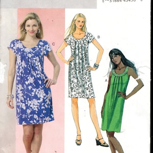 May include: Butterick B5488 sewing pattern featuring three dress designs. The pattern includes a blue floral dress, a white and black swirl print dress, and a green dress. The pattern size is ZZ (Lrg-Xlg-Xxl).