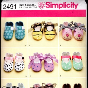 May include: Simplicity pattern 2491 featuring various baby shoe designs. The pattern includes shoes with polka dots, animal faces, and bows. The image shows the different shoe styles, including a bee, monkey, and bear design.
