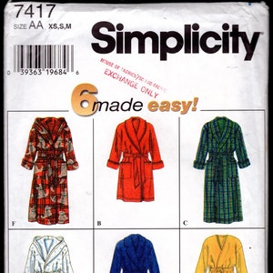 May include: Simplicity sewing pattern 7417 featuring six different robe designs. The robes are in various colors and patterns, including red, blue, green plaid, and a robe with a cat print. The pattern includes sizes XS, S, and M.