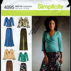 May include: A sewing pattern for a wrap top and skirt. The pattern includes a teal top with a wrap front, a brown and white plaid top with a ruffle detail, a blue skirt with a ruffle detail, and a black and floral skirt with a slit.
