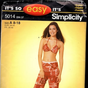 May include: A Simplicity sewing pattern for a red and white patterned bikini top and pants. The pattern number is 5014 and the size is A 8-18. The pattern is for sizes EUR 34-44 and FR 36-46.