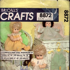 May include: Vintage McCall's Crafts pattern 8872 for a complete baby doll wardrobe. The pattern includes instructions for three sizes: 13-14 inches, 15-16 inches, and 17-18 inches. The image shows dolls and doll clothes.