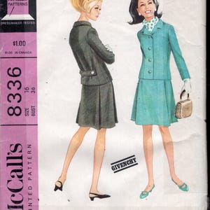 May include: A vintage McCall's sewing pattern for a Misses' suit, showing illustrations of two women in fashionable outfits. The pattern includes a dark grey suit and a teal suit, both with skirts. The pattern is size 16, bust 91.4 cm.