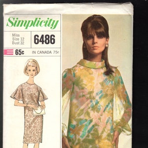 May include: Simplicity sewing pattern number 6486 for a dress. The pattern is for a miss, size 12, bust 32. The pattern is suitable for lace, eyelet, and sheers. The pattern shows two versions of the dress, one with a floral print and one with a solid print.