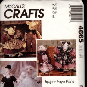 May include: A sewing pattern for making 18-inch (46 cm) stuffed pig dolls. The pattern includes instructions for making a bride and groom pig doll, a pig doll in a pink dress, and a pig doll in a blue and white dress. The pattern is titled "This Little Piggie... Ce Petit Cochon Rose..." and is by/par Faye Wine.