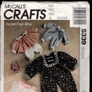 May include: A sewing pattern for making clothes for small rabbits. The pattern includes instructions for making a dress, a jumpsuit, and a tutu. The pattern is called "Bunny Wraps" and is from McCall's Crafts.
