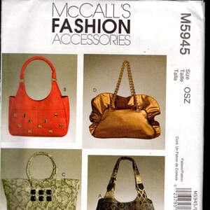 May include: A McCall's Fashion Accessories pattern sheet featuring four different handbag designs. The bags vary in shape, color, and material, including a red studded tote, a gold satin bag with a chain handle, a snakeskin print tote, and a patterned shoulder bag.