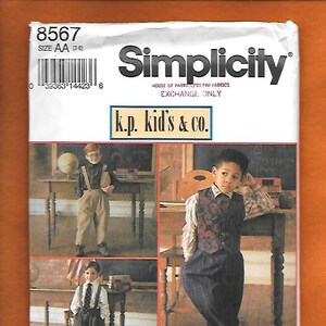 May include: Simplicity sewing pattern number 8567 for children's clothing. The pattern includes instructions for making a pair of pants and a vest. The pattern is illustrated with three children wearing the clothing.