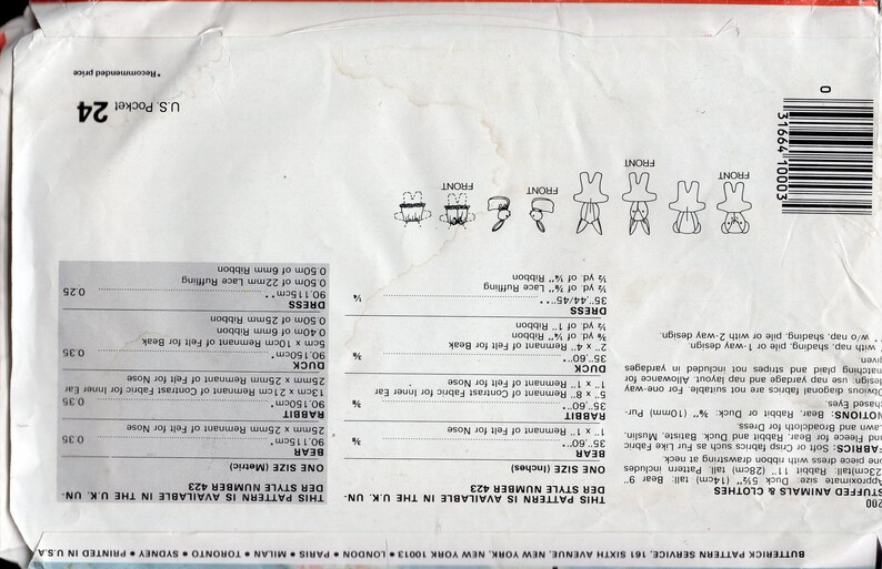 May include: A white paper sewing pattern envelope for stuffed animals and clothes, featuring line drawings of a bear, rabbit, and duck. The back includes fabric requirements in inches and centimeters, a barcode, and the text Butterick Pattern Service.