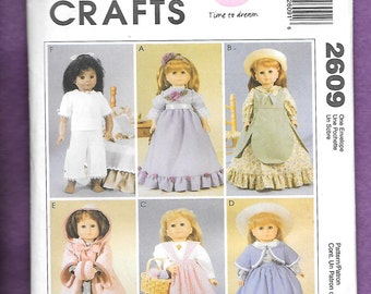 May include: McCall's Crafts sewing pattern envelope featuring doll clothing designs. The envelope displays six dolls in various outfits, including dresses, a cape, and a bonnet. The text "Time to dream" is also visible.