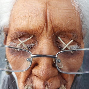 May include: A set of three ceramic mugs with a speckled, matte finish. The mugs are in shades of cream, light gray, and dark gray. Each mug has a simple, minimalist design and a rounded handle.