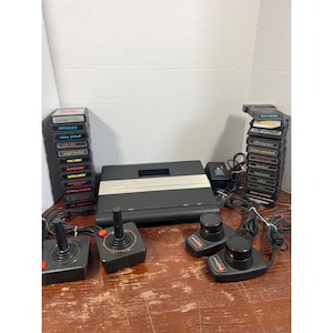 Atari 7800 ProSystem Console With Joysticks Paddle Controllers & 26 Game Cartridges