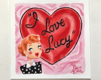 May include: A watercolor painting of a cartoon character with red hair and a red heart with the text "I Love Lucy" on it. The background is pink.