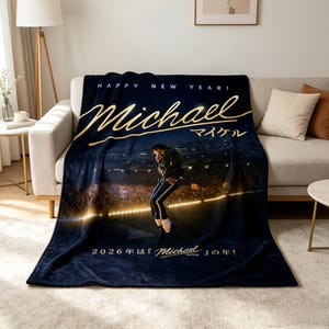 May include: A navy blue fleece blanket featuring a concert image of Michael Jackson. The blanket has gold text that reads "Happy New Year! Michael" and Japanese text. The bottom of the blanket reads "2026 is the year of Michael!" in both English and Japanese.