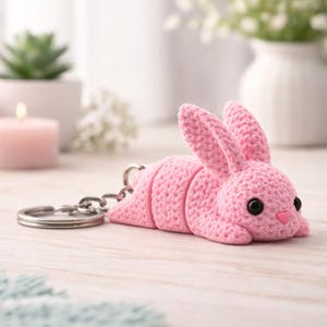 May include: A set of three ceramic mugs with a speckled, matte finish. The mugs are in shades of cream, light gray, and dark gray. Each mug has a simple, minimalist design, perfect for coffee or tea.