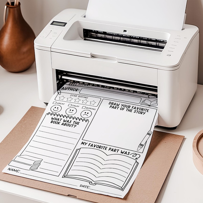 May include: A white printer printing a black and white book review sheet. The sheet includes sections for author, star rating, book summary, and a drawing area. A brown paper is under the printed sheet.