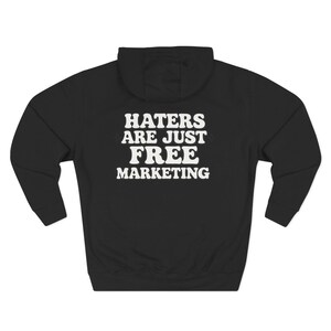 Haters Are Just Free Marketing Hoodie Script Phrase Pullover Quote Streetwear Message Viral Saying I love haters apparel image 6