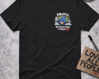 Camiseta gráfica "Ningún ser humano es ilegal", de Misfit Earth, justicia social
