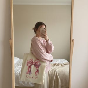 May include: A set of three ceramic mugs with a speckled, matte finish. The mugs are in shades of cream, light gray, and dark gray. Each mug has a simple, minimalist design, perfect for coffee or tea.