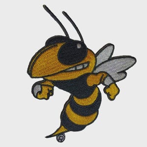May include: Embroidered patch featuring a stylized yellow and black hornet mascot with a determined expression. The hornet is depicted with black sunglasses, wings, and a striped abdomen. The patch is designed for application on apparel or accessories.