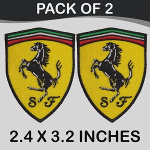 May include: A white ceramic mug with a black handle and the text "But First, Coffee" in a black, handwritten-style font. The mug is on a white surface.