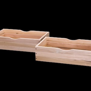 May include: Two rectangular wooden storage boxes with a natural wood finish. Each box has a curved cutout on one side for easy access. The boxes are constructed with horizontal wooden planks and secured with small nails.