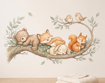 May include: A wall decal illustration featuring a brown bear, a fox, a rabbit, and a squirrel sleeping on a tree branch with green leaves, accompanied by two small birds perched on a higher twig, all rendered in a soft, watercolor-style aesthetic.