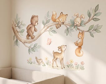 May include: A wall decal featuring a watercolor illustration of a brown bear, a fox, a rabbit, a squirrel, and a deer. The animals are positioned on a tree branch with green leaves, a small bird, flowers, and a pink butterfly nearby.