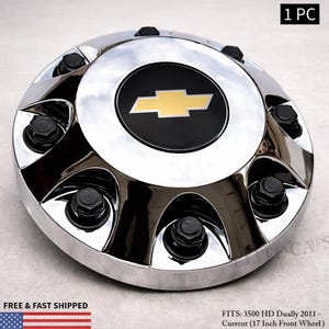 May include: Chrome hubcap with a black center featuring a gold Chevrolet logo. The hubcap has black lug nuts and is labeled "1 PC". The text "FREE & FAST SHIPPED" is also visible. Fits 3500 HD Dually 2011 - Current (17 Inch Front Wheel).