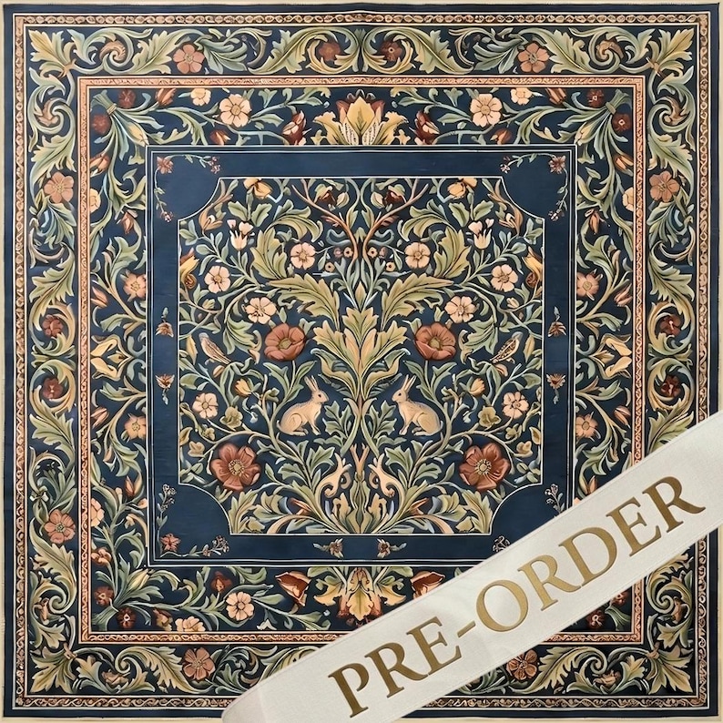 May include: A square textile featuring a dark blue background with a symmetrical pattern of light brown rabbits, green foliage, and pink flowers. A wide decorative border frames the central design. A white diagonal banner displays the text PRE-ORDER.