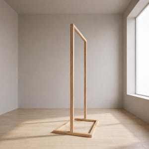 May include: A freestanding rectangular clothing rack constructed from light-toned wood. The structure consists of a flat rectangular base frame with two vertical posts connected by a single horizontal top bar, forming an open frame design.
