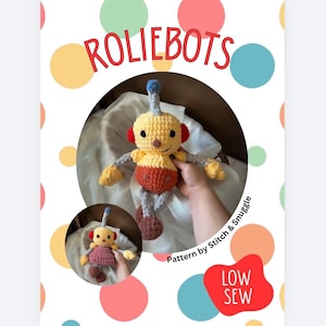 May include: A crochet robot toy named ROLIEBOTS with a yellow head, red ears, and a blue antenna. The body is yellow and orange with gray limbs and brown feet. The text reads ROLIEBOTS, Pattern by Stitch & Snuggle, and LOW SEW.