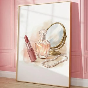 May include: A framed print featuring a still life of beauty items. The image includes a lipstick, perfume bottle, a small round mirror, and a pearl necklace. The color palette is soft, with pinks, golds, and whites, creating a feminine aesthetic.