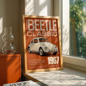 May include: A framed poster featuring a cream-coloured Volkswagen Beetle Classic car on a burnt orange background. The text reads Volkswagen Beetle Classic 1967, along with descriptive phrases about the vehicle's design and its status as a motoring icon.