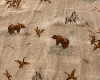 Heavier weight flannel print, bears, geese, ducks, wolves, flannel cotton fabric.    3/22.