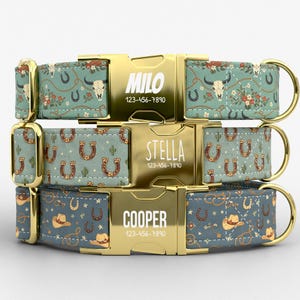 May include: Three personalized dog collars with gold-colored buckles. The collars feature western-themed patterns with horseshoes, cacti, and cowboy hats. Each buckle is engraved with a name and phone number. The collars are in shades of blue, green, and brown.