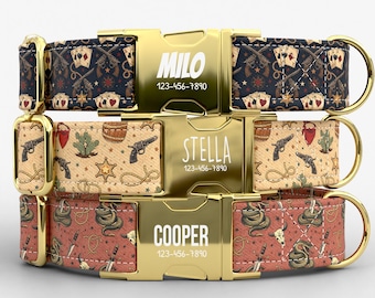May include: Three personalized dog collars with gold-colored buckles. The top collar is navy blue with a playing card and gun pattern, the middle is tan with a cactus and gun pattern, and the bottom is red with a snake pattern. Each collar has a name and phone number.