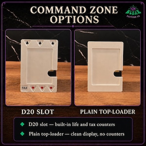 May include: Two white rectangular card holders. The left holder features a D20 slot, three heart icons, and the text TAX. The right holder is a plain top-loader. Both are designed for command zone display with integrated slots for game cards.