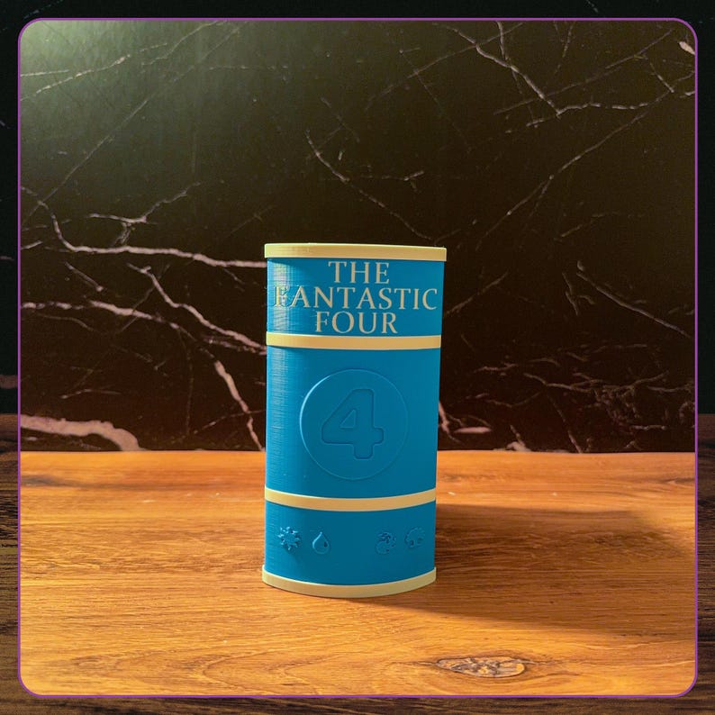 May include: A cylindrical blue container featuring the text THE FANTASTIC FOUR in light yellow lettering at the top. A large number 4 is embossed in the center, and four small icons representing elemental symbols are aligned along the bottom edge.