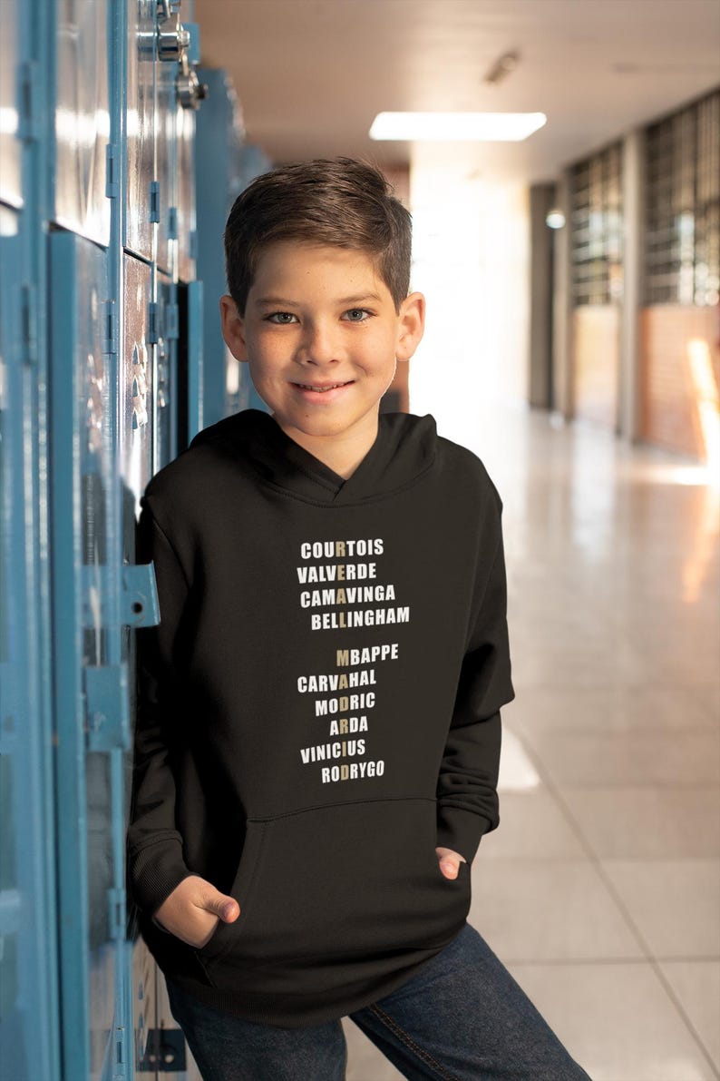 Real Madrid players lineup in their iconic white kits, standing side by side with a strong and determined presence. The backdrop captures the energy of the stadium, highlighting the unity and championship spirit of the team. Perfect for passionate Madridistas and football fans alike.