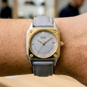Raro reloj vintage Seiko de cuarzo 6432-6000 con tanque, caja cuadrada de dos tonos en oro y plata, esfera y correa grises, auténtico reloj unisex de lujo.