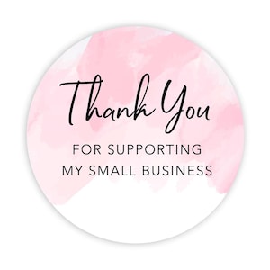 May include: A round sticker with a watercolor-style pink background and white border. The sticker features the words "Thank You" in a handwritten font, with the text "FOR SUPPORTING MY SMALL BUSINESS" below.