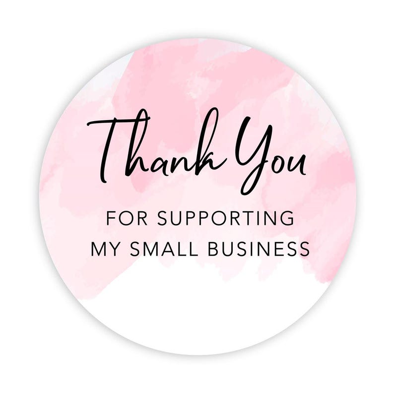May include: A round sticker with a watercolor-style pink background and white border. The sticker features the words "Thank You" in a handwritten font, with the text "FOR SUPPORTING MY SMALL BUSINESS" below.