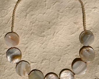one of a kind beaded necklace made from vintage pearl toned beads, shell statement beads, and gold components