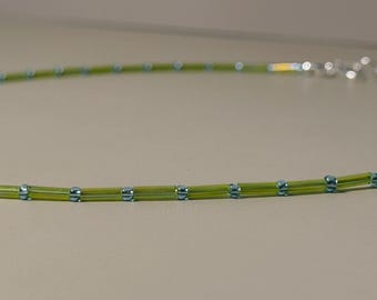 teal and green beaded necklace with silver components