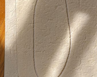 one of a kind beaded necklace made from a disassembled, vintage necklace and silver components