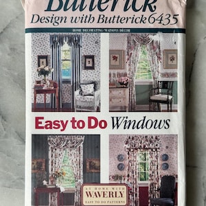 May include: A vintage Butterick sewing pattern for home decorating, featuring designs for windows. The cover displays images of various window treatments, with text that reads "Easy to Do Windows" and "At Home with Waverly". The pattern includes the text "Design with Butterick 6435".