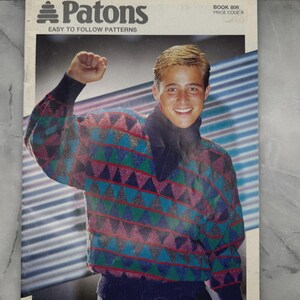 May include: A vintage Patons knitting pattern book cover showing a person in a colourful geometric patterned sweater. The cover includes the text "Patons EASY TO FOLLOW PATTERNS" and "THE STUDIO COLLECTION".